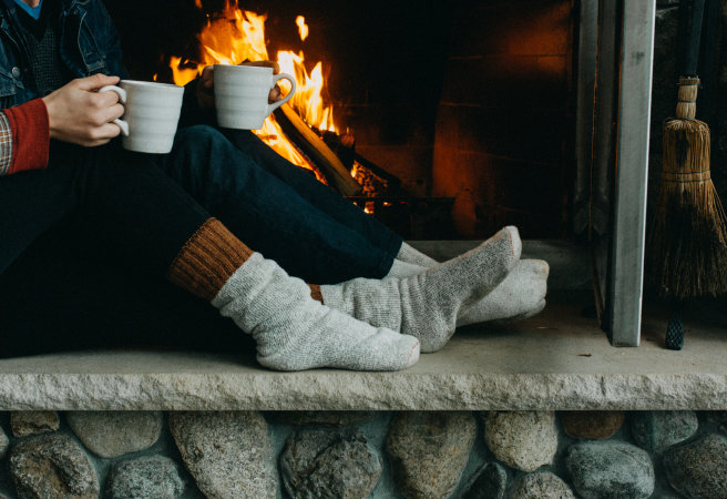 Warming feet by the fire